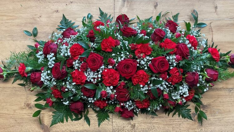 Floral spray for coffin red roses
